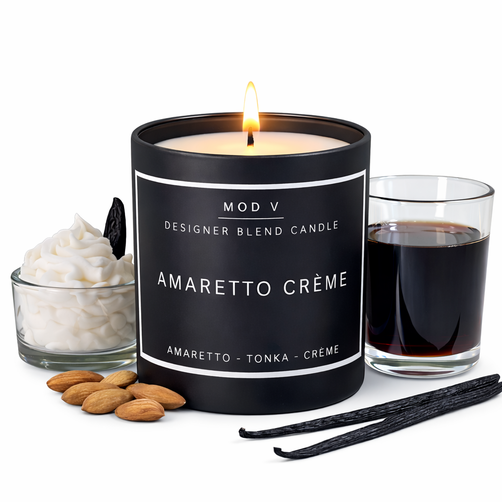 Amaretto Crème candle with vanilla beans, almonds, and a glass of dark liquid on a white background