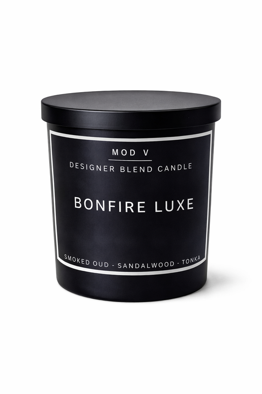 Black candle container with 'Bonfire Luxe' branding on a white background