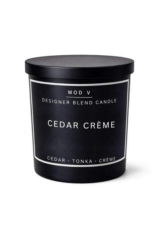 Black candle container labeled 'Cedar Crème' with 'Mod V' branding on a white background