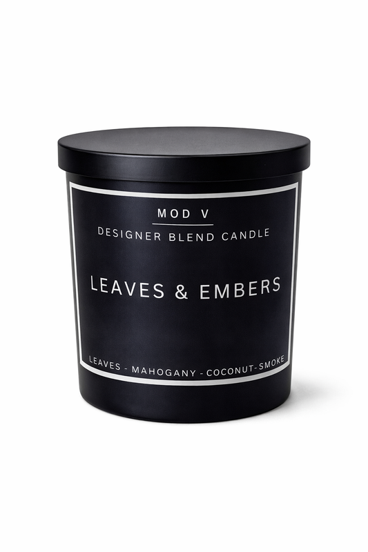Candle with 'Leaves & Embers' fragrance on a white background