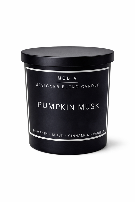 Black candle container with 'Pumpkin Musk' label on a white background