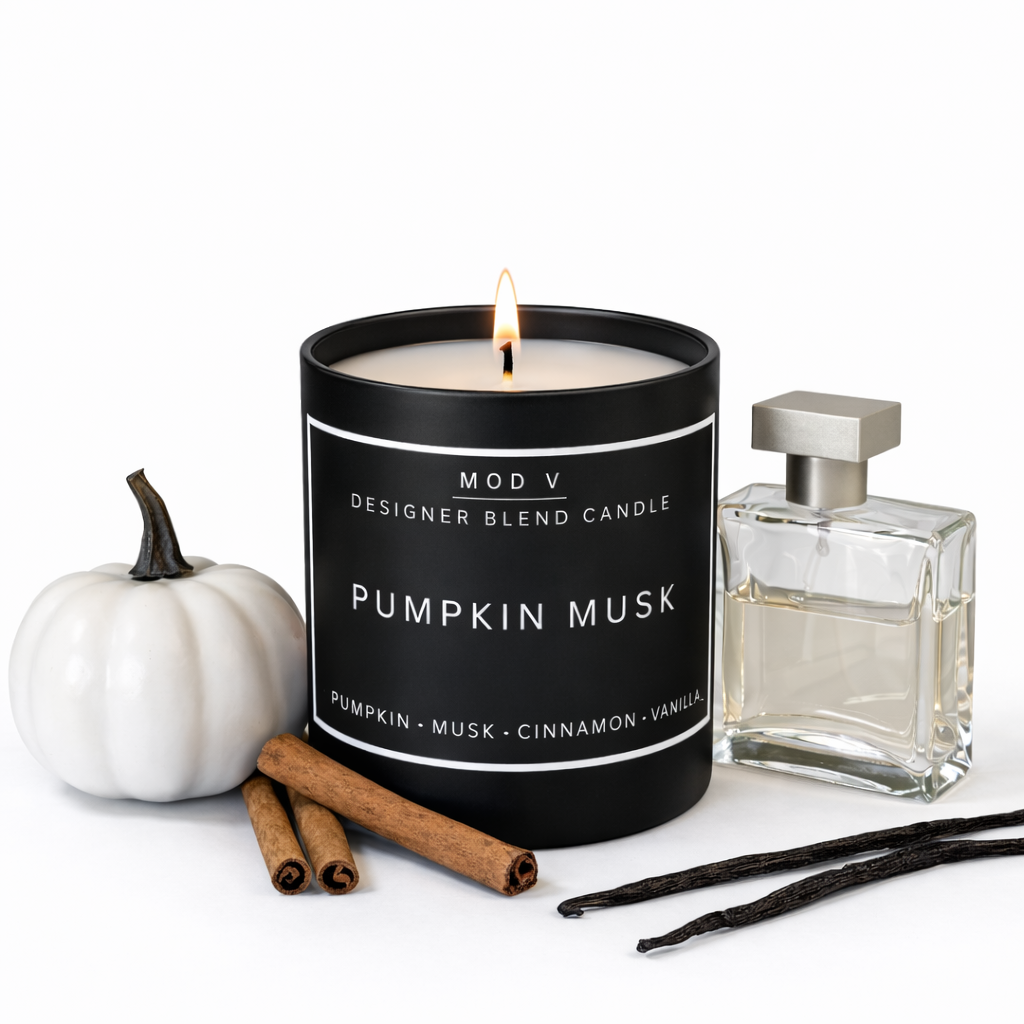 Candle labeled 'Pumpkin Musk' with a white pumpkin, cinnamon sticks, and vanilla bean on a white background