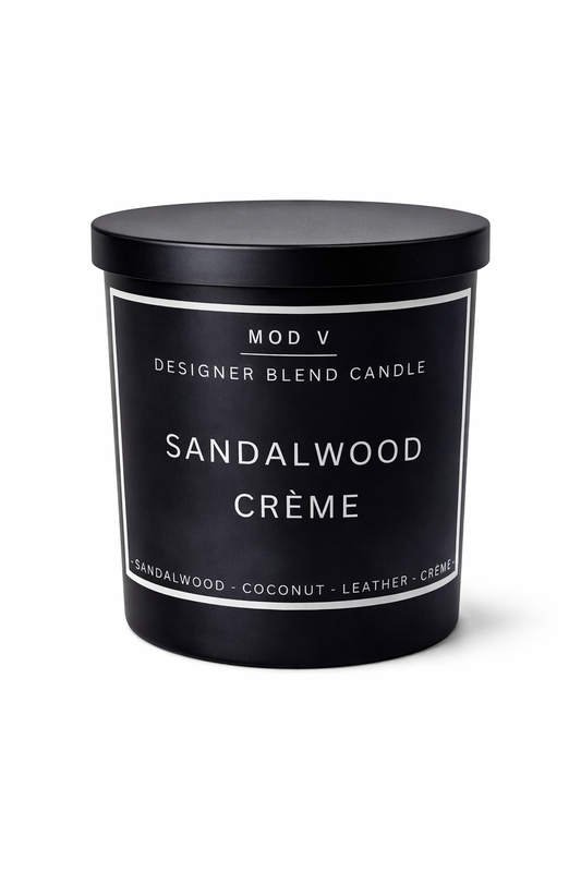 Sandalwood Crème candle with black lid and label on a white background