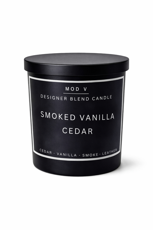 Black candle container with 'Smoked Vanilla Cedar' fragrance on a white background