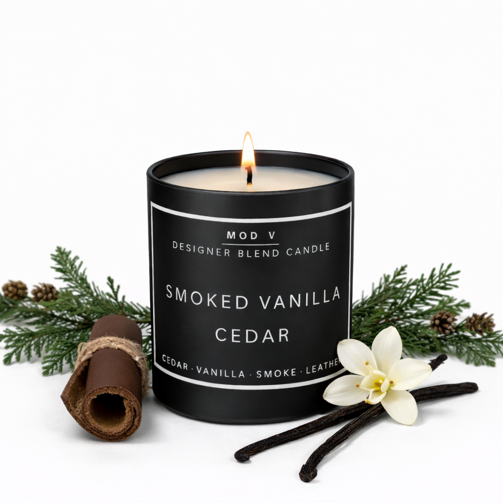 Candle labeled 'Smoked Vanilla Cedar' with vanilla beans and a flower on a white background
