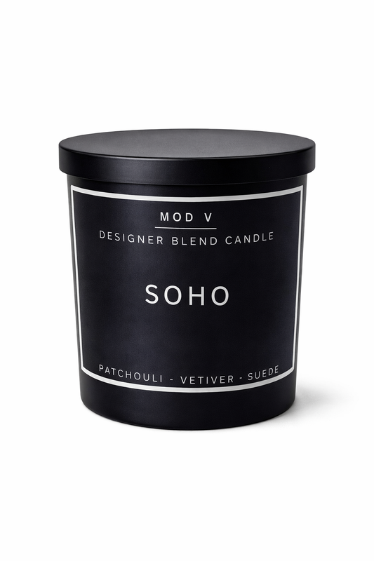 Black candle with 'Soho' label on a white background