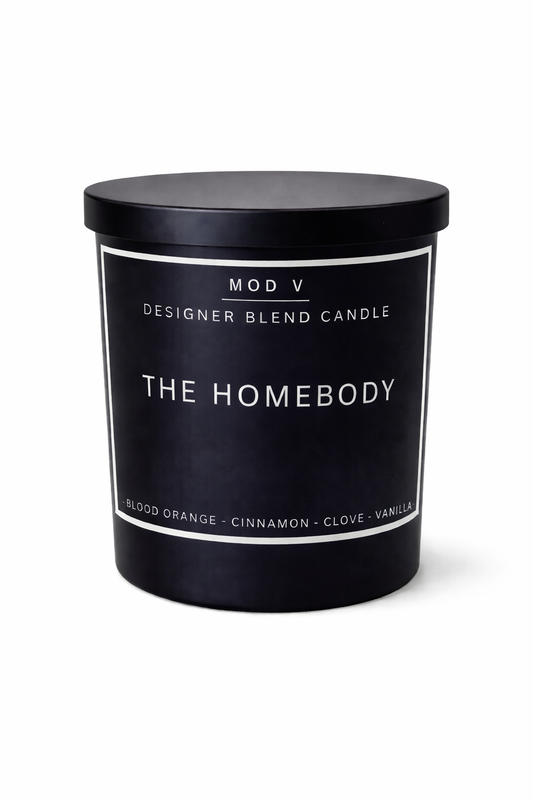 Black candle with 'The Homebody' label on a white background