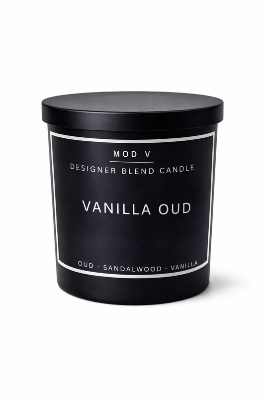 Vanilla Oud candle with black lid and label on a white background