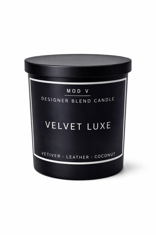 Black candle container with 'Velvet Luxe' label on a white background
